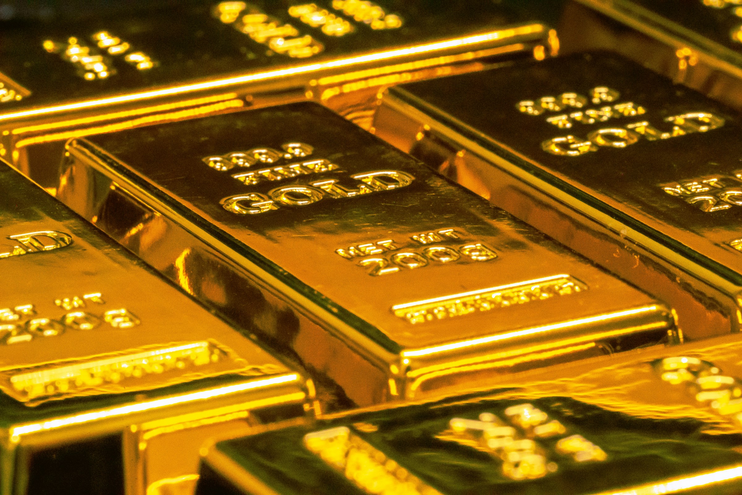 Stack of physical gold bars sealed at the source of attestation